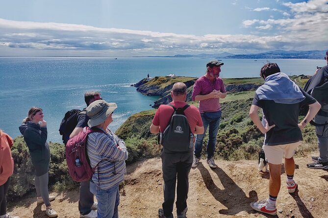 Dublin Coastal Hike, Pints & Puppies Adventure - Howth Lighthouse and St Mary’s Abbey ruins, where views meet old stone
