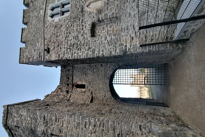Swords Dublin Ireland Walking Tour Fun Experience - Swords Castle grounds, the medieval palace story, and the Round Tower connection